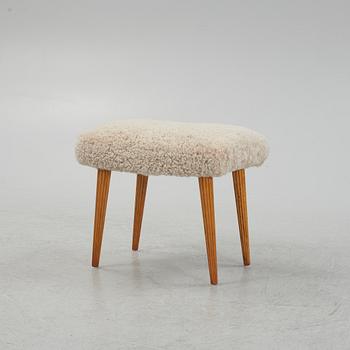 A sheepskin upholstered stool, mid 20th Century.
