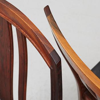 Bertil Fridhagen, a rosewood-veneered dining table with four chairs, BOdsfors, Sweden, 1960's.