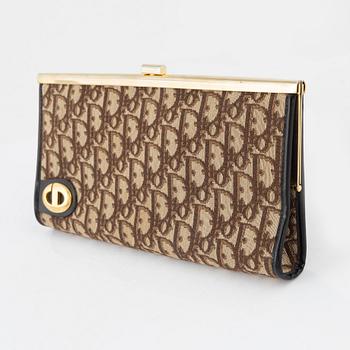 Christian Dior, a canvas clutch.