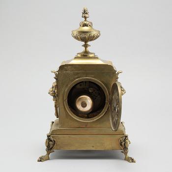 A table clock and two candelabras, around the year 1900.