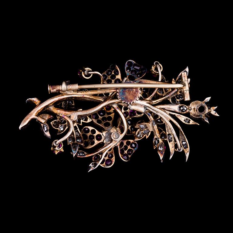 A BROOCH, rubies, old cut diamonds, gold and silver. Late 1800s.