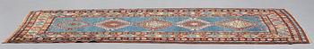 A RUNNER, a semi-antique Caucasian, ca 303,5 x 129,5-140,5 cm (as well as one end with 2,5 cm flat weave).