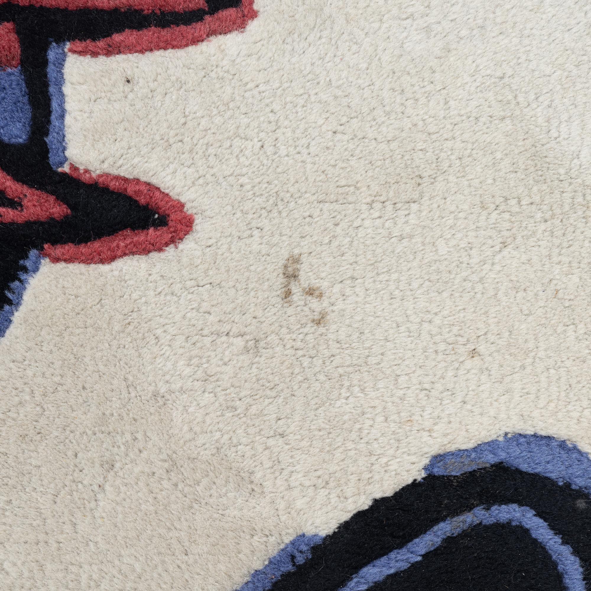 Beverloo Corneille, 'L'oiseau chasseur de serpent', after. A handtufted carpet, c. 247 x 199 cm.