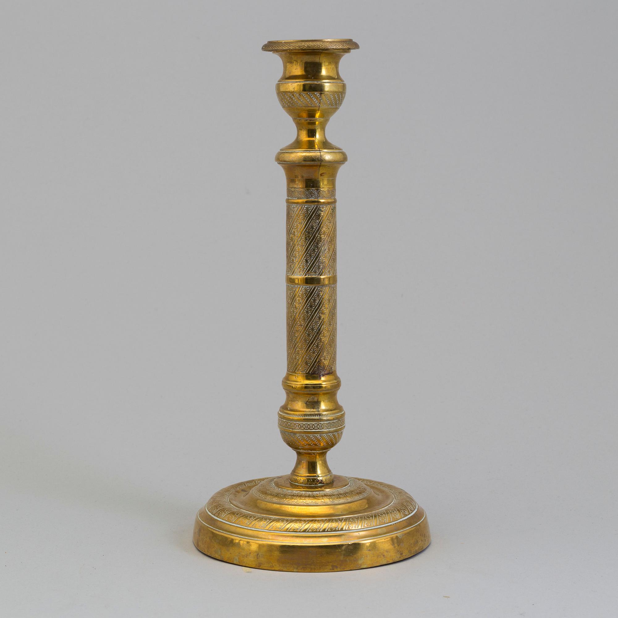AN EMPIRE ORMOLU CANDLESTICK, first half of the 19th century.