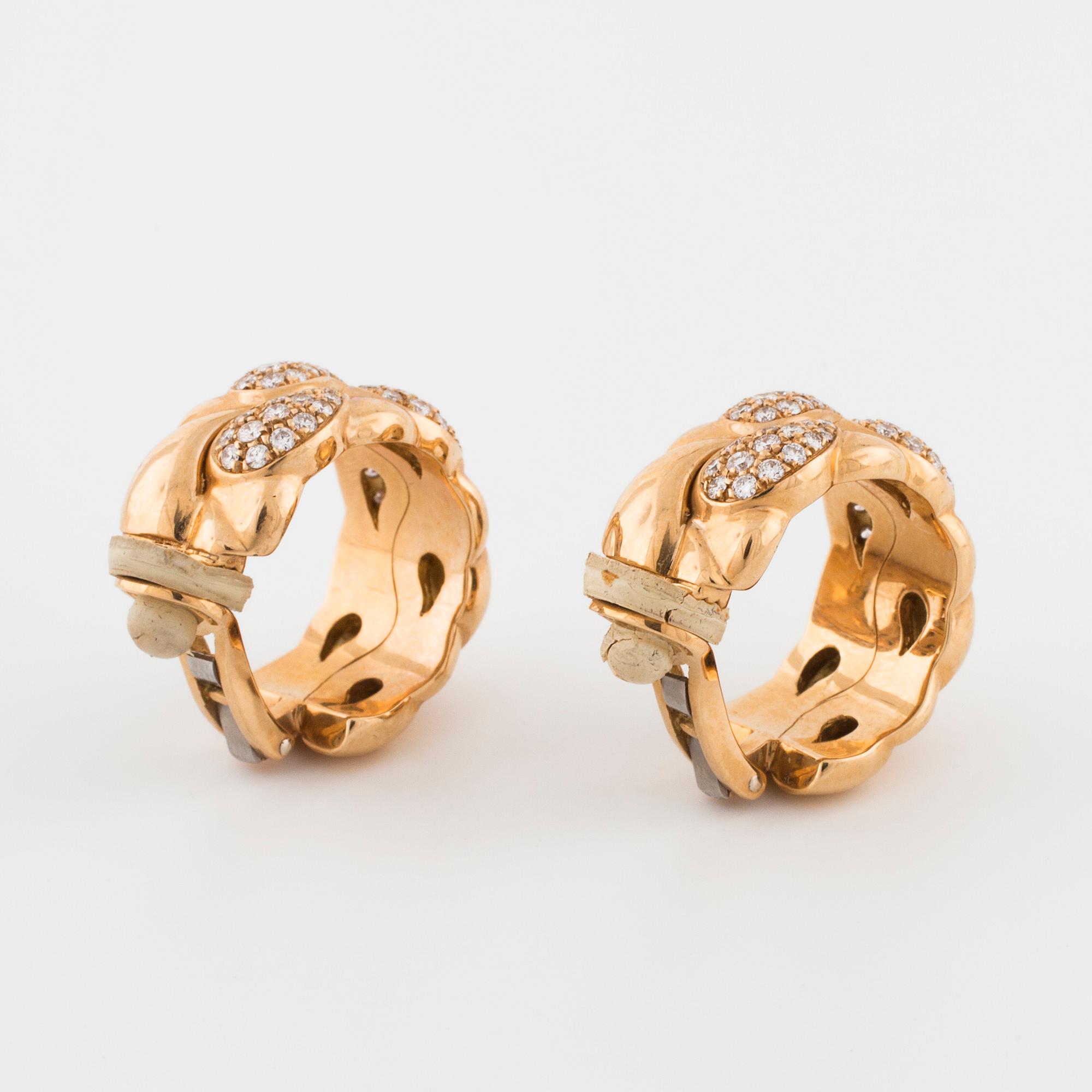 CHOPARD, a pair of "Casmir" earrings set with brilliant cut diamonds.