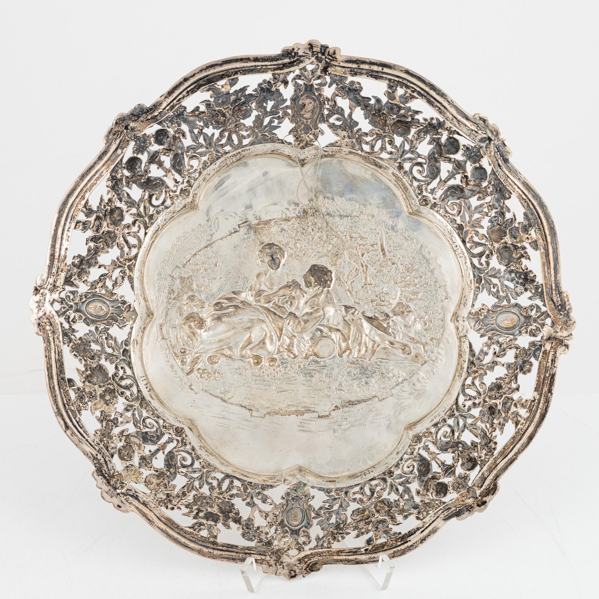 Two silver platters, presumably Wilhelm Weinranck, Hanau, and mock marks, Hanau, Germany, late 19th century.
