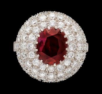 709. A gold, ruby and diamond ring.