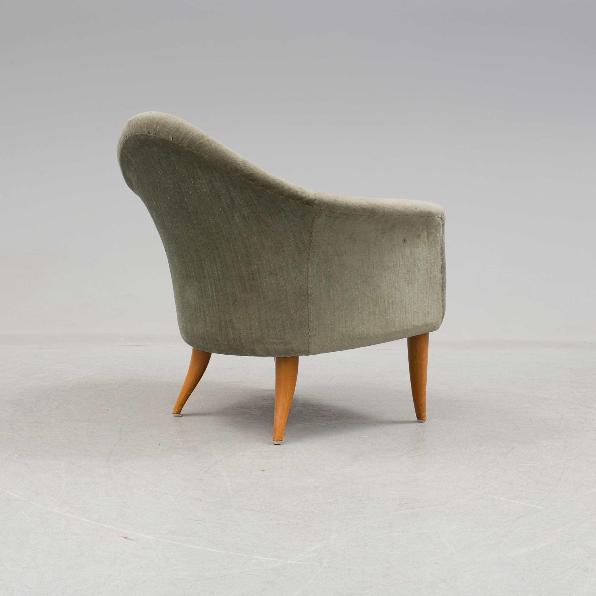 A easy chair "Lilla Adam" by Kerstin Hörlin-Holmquist.