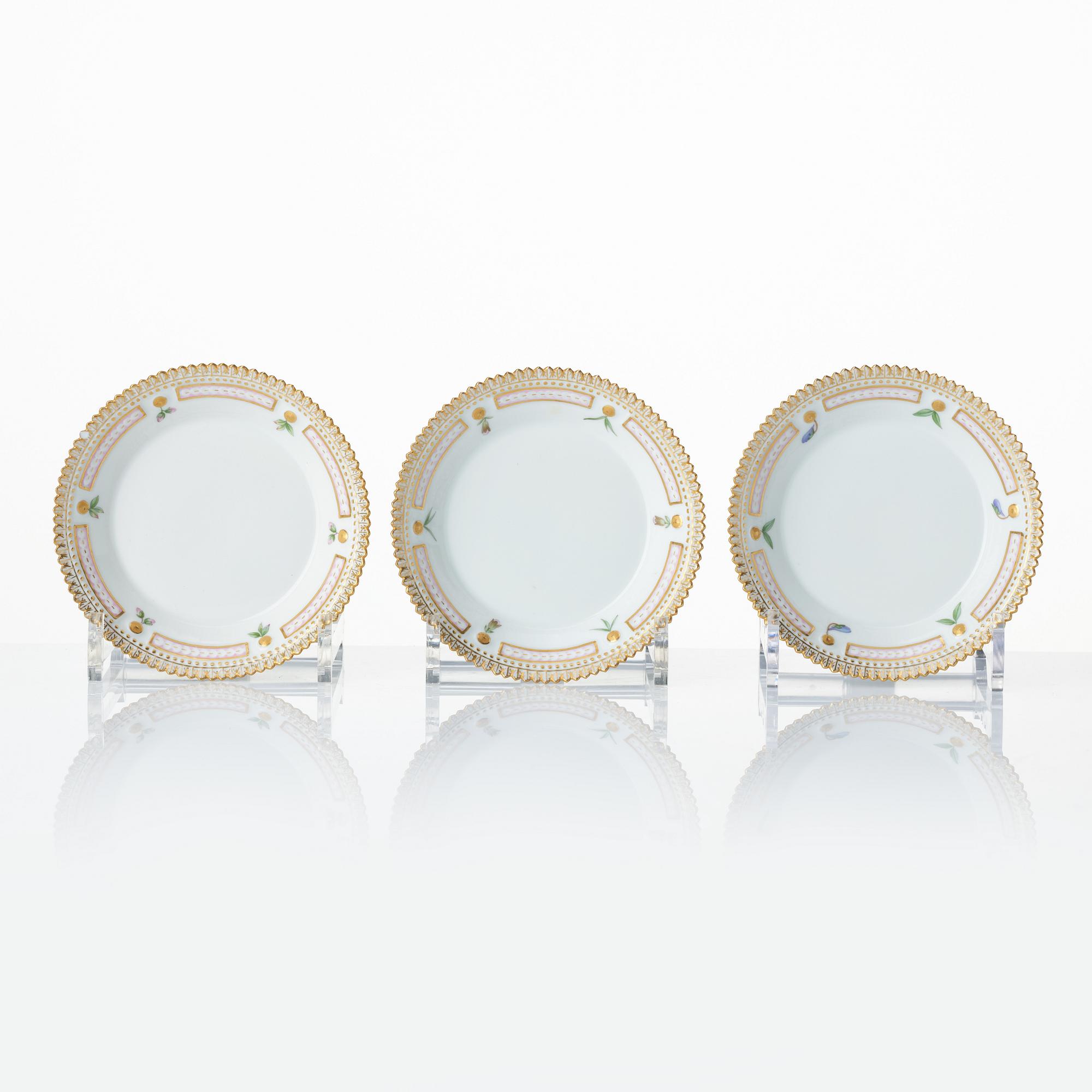 A set with a Royal Copenhagen 'Flora Danica' triangular dish, a sugar bowl with cover and three small dishes, Denmark,