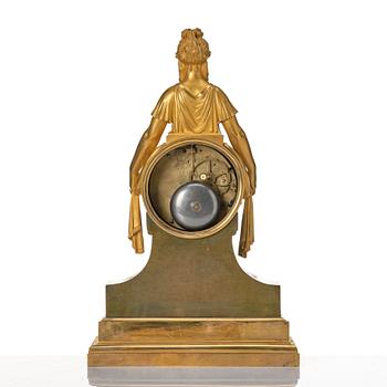 An Empire bronze mantle clock.