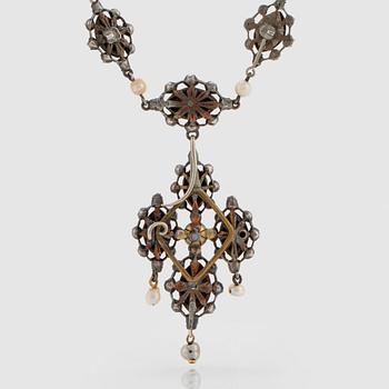 A silver necklace/pendant set with rose-cut diamonds and pearls.