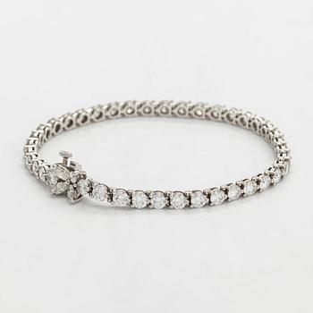 Tiffany & Co, "Victoria" tennisrannekoru, platinaa sekä briljantti- ja marquisehiottuja timantteja.