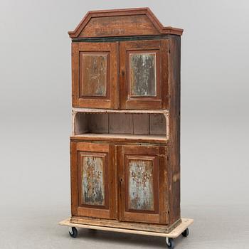 A painted cabinet dated 1860.