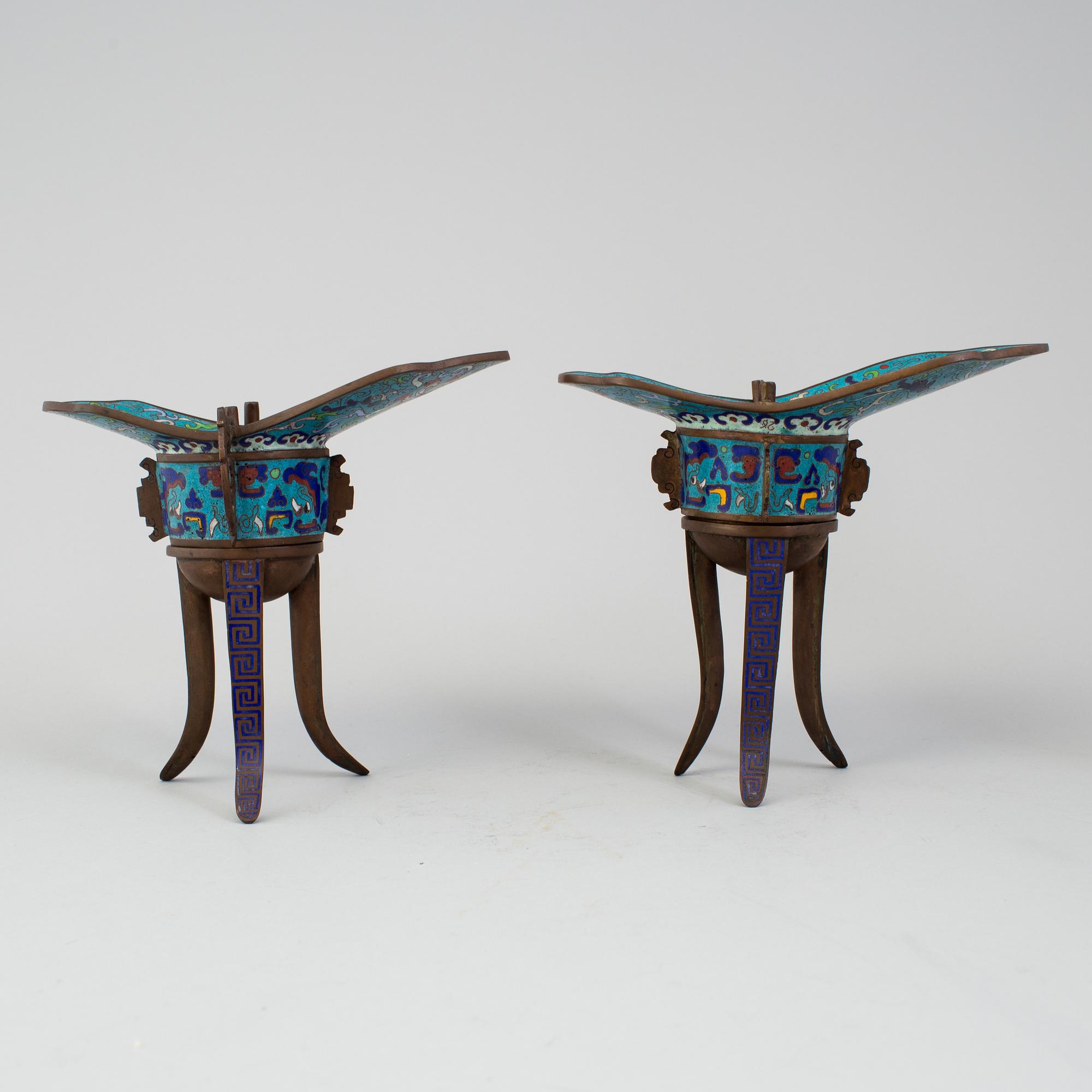 A pair of chinese cloisonné tripod wine vessels, 20th century.