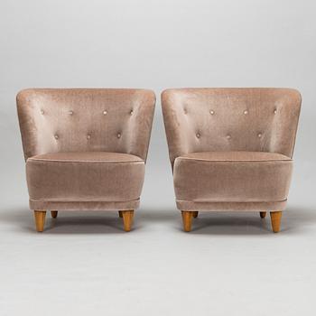 A mid-20th-century pair of armchairs.