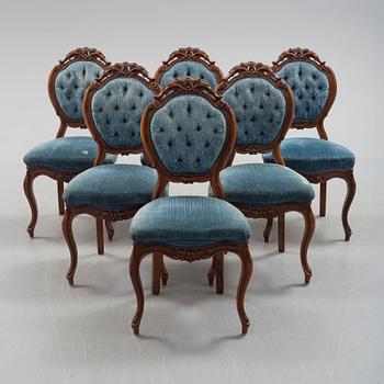 Six late 19th century walnut chairs.