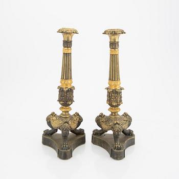 A pair of late Empire candle sticks.
