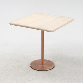 A steel and oak table by Jonas Lindvall 2011.