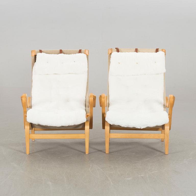 BRUNO MATHSSON, a pair of Pernilla, Dux lounge chair.