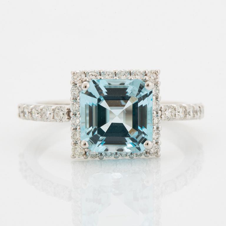 Blue topaz and brilliant-cut diamond ring.