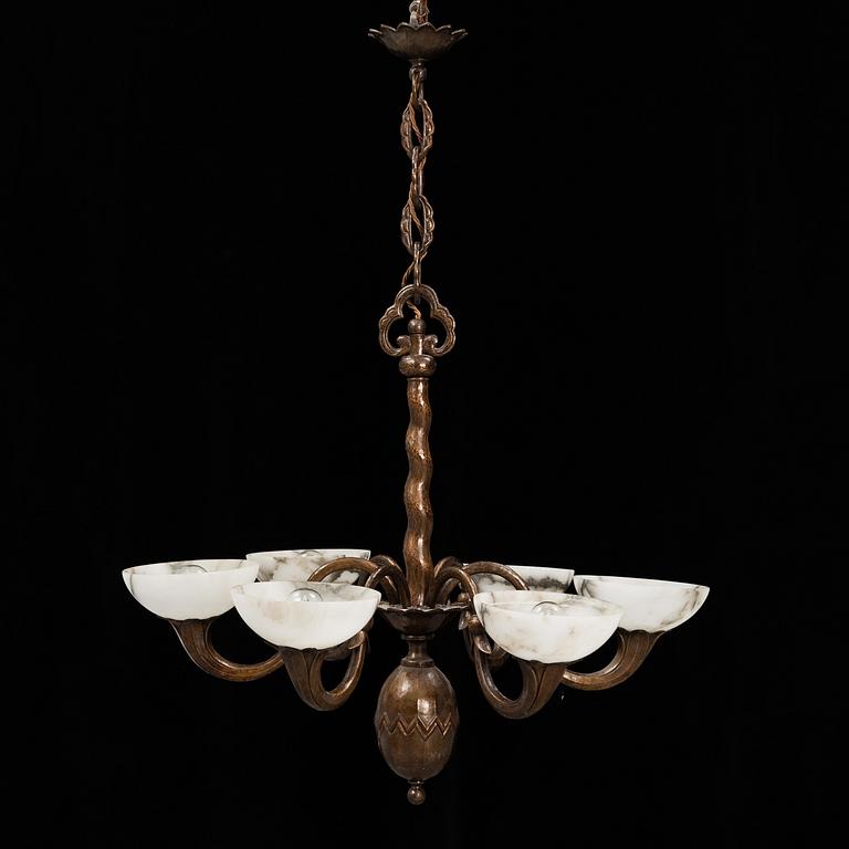 A 1920s-30s copper and alabaster ceiling light.