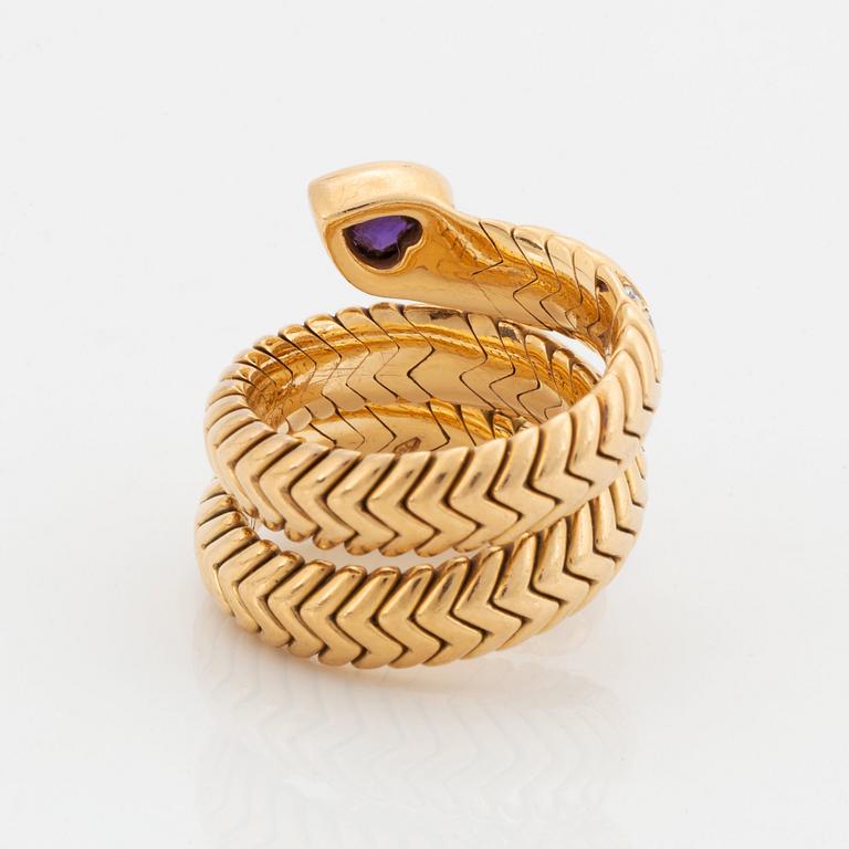 A Bulgari "Spiga" 18K gold ring set with an amethyst and round brilliant-cut diamonds.