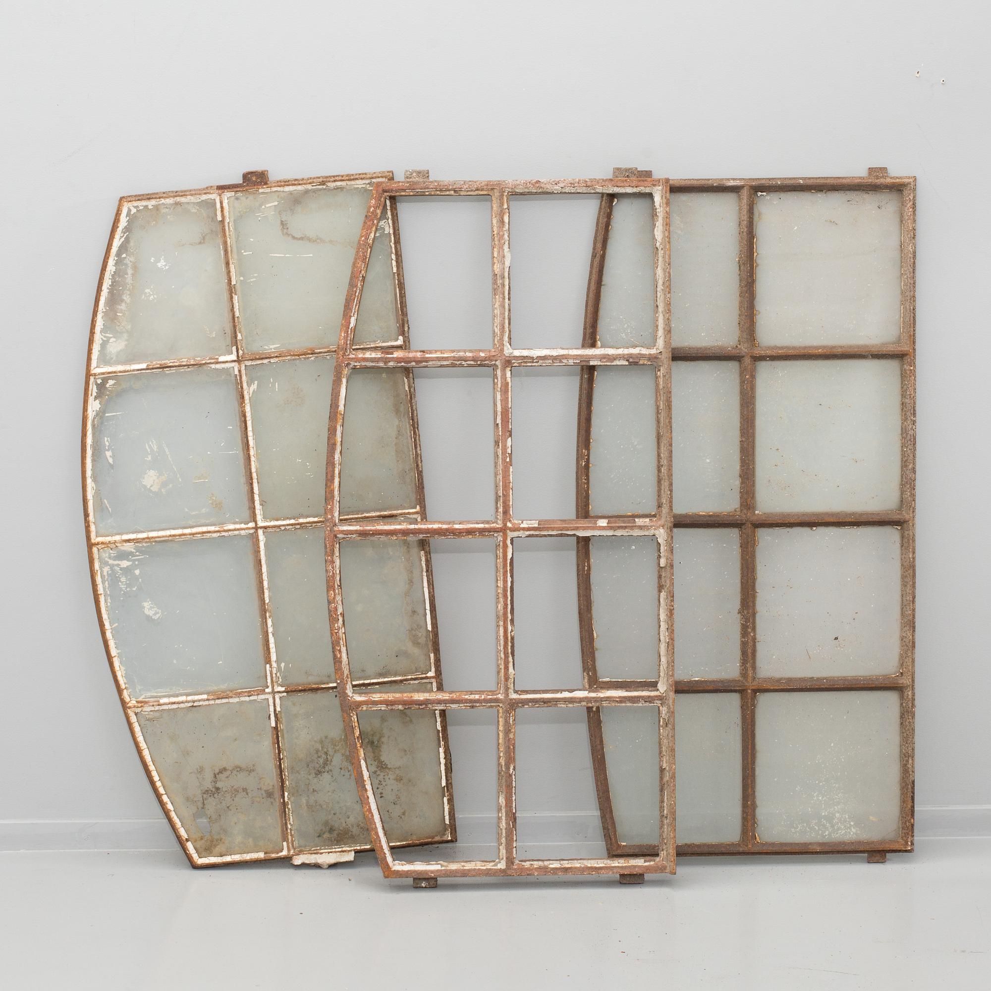 THREE CAST IRON WINDOW FRAMES, first half of the 20th century.