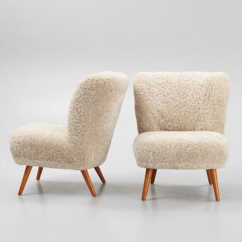 A pair of mid 20th Century easy chairs.