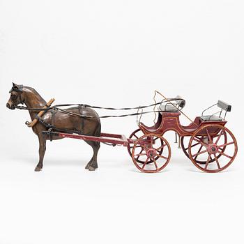 Horse-drawn carriage, early 20th century.