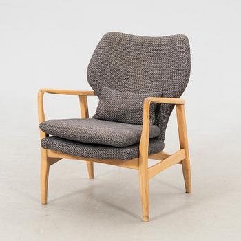 Armchair with armrests, modern manufacture.