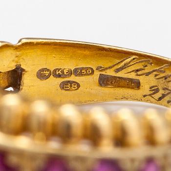 An 18K gold ring with rubies. Italy, finnish import marks.