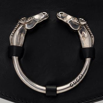 A LEATHER RIBOT HORSE HEAD CLUTCH.