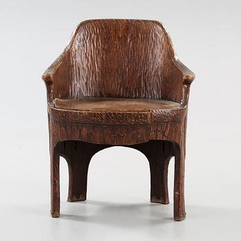 A Gustav Fjaestad Art Nouveau carved pine chair, 'Stabbestol', by Adolf Swanson, Arvika, Sweden 1908.