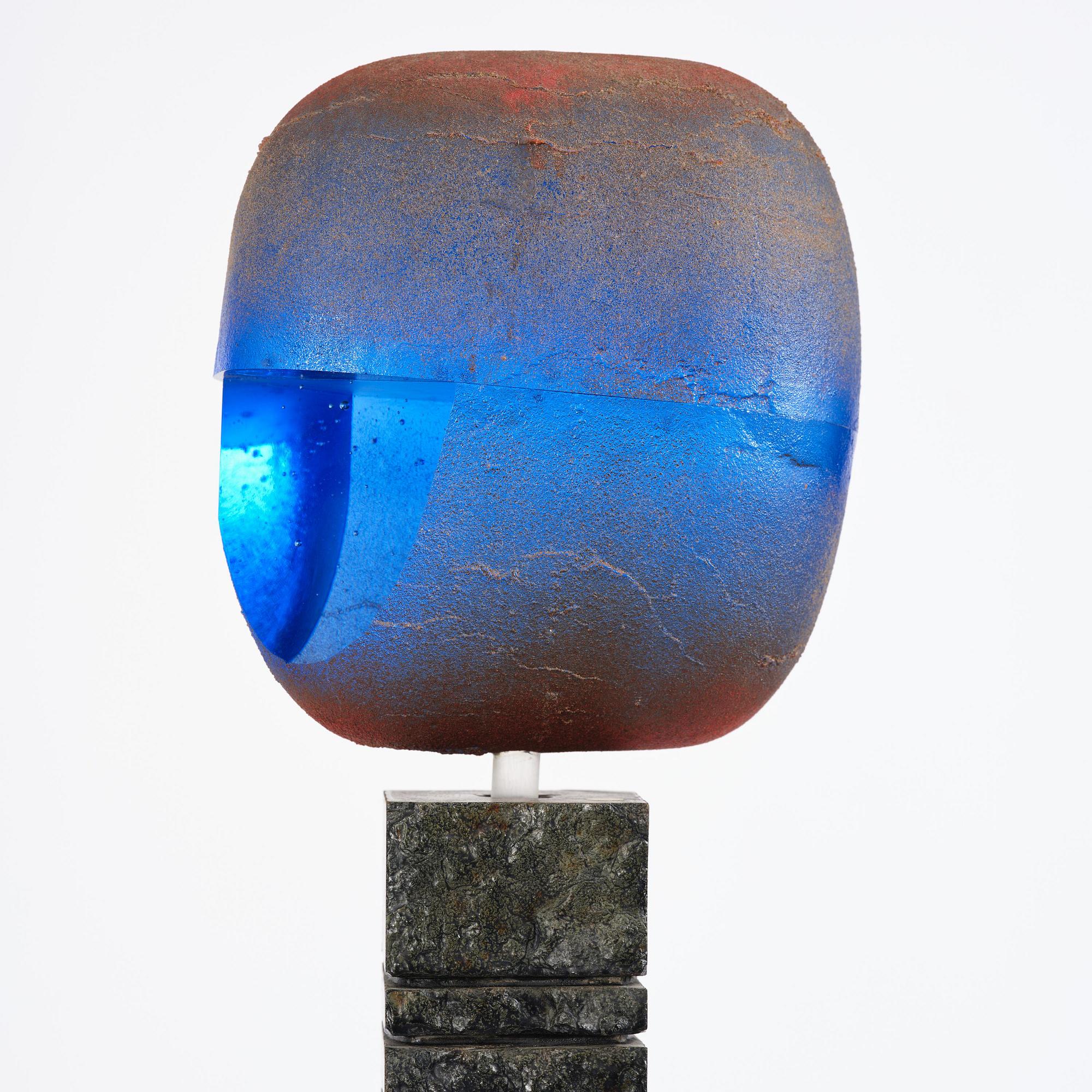 Bertil Vallien, a unique sand-cast glass sculpture of a head, on a high pedestal of polished limestone, Kosta Boda.
