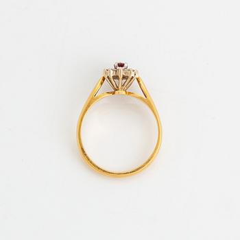 Navette cut ruby and brilliant cut diamond ring.