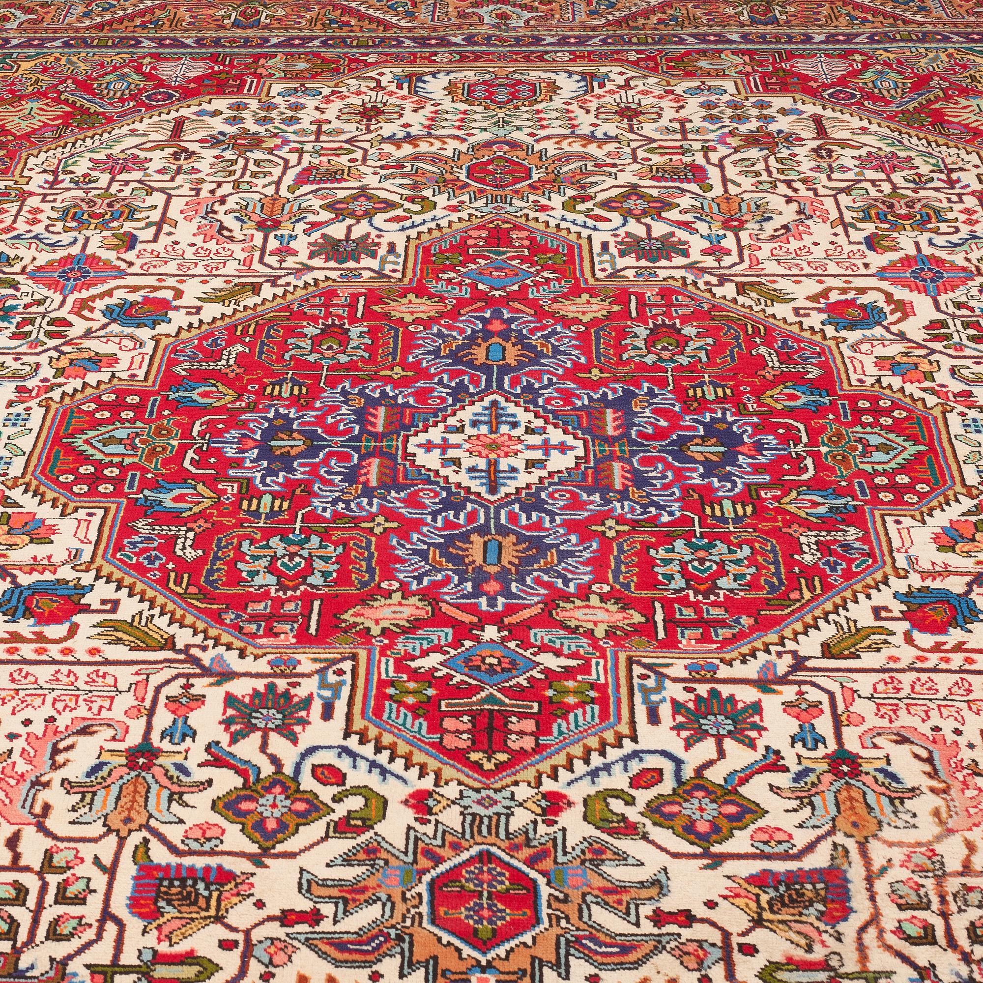 A carpet from Tabriz, around 388 x 294 cm.