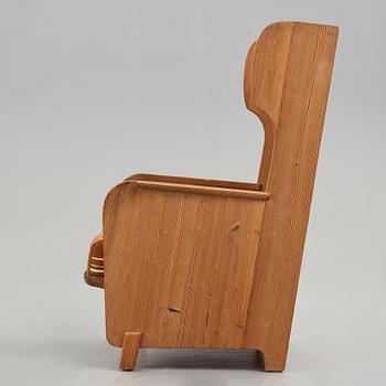 Axel Einar Hjorth, a "Lovö" stained pine armchair, Nordiska Kompaniet, Sweden, 1930's.