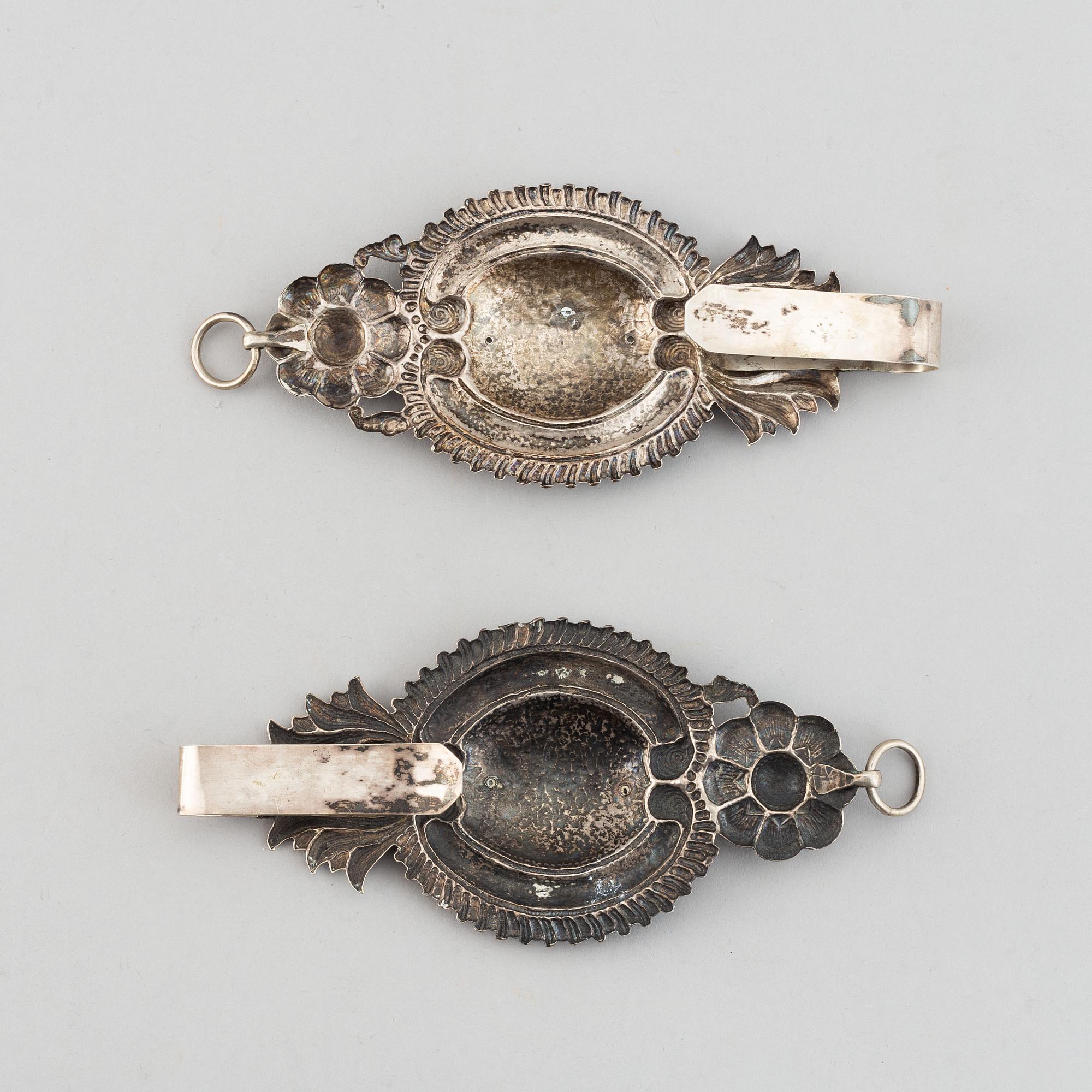A pair of 19th century silver curtain tie-backs.