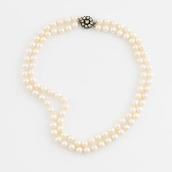 Cultured two strand pearl necklace, clasp silver with paste.