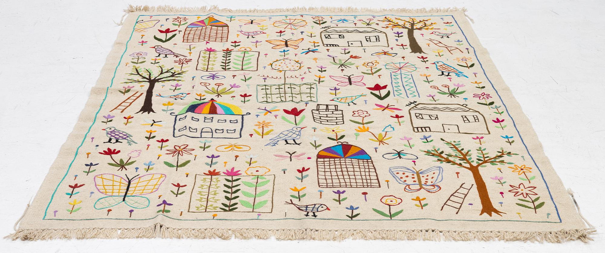 A hand-embroidered kilim rug, c. 224 x 172 cm.