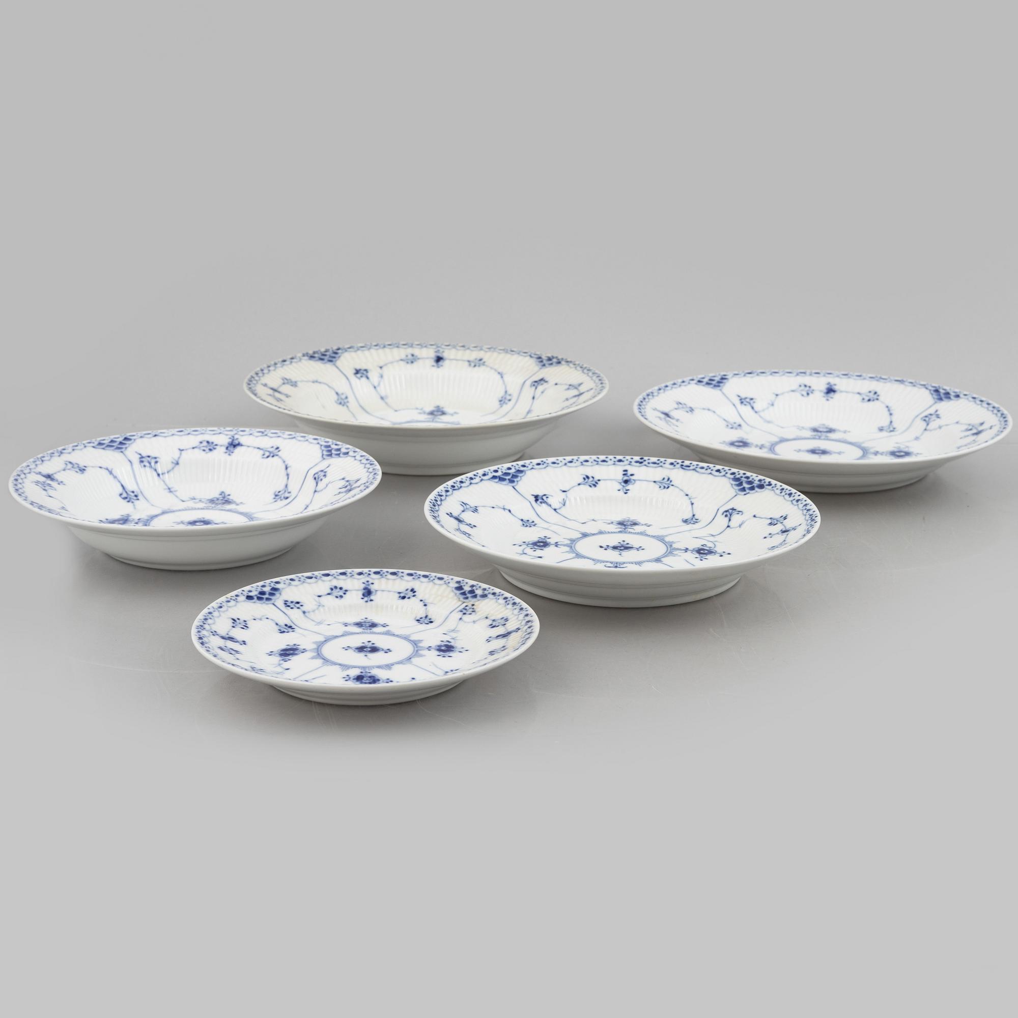 Royal Copenhagen, a 116-piece 'blue Fluted' porcelain dinner and coffee service, half lace, Denmark, mostly 1923-34.