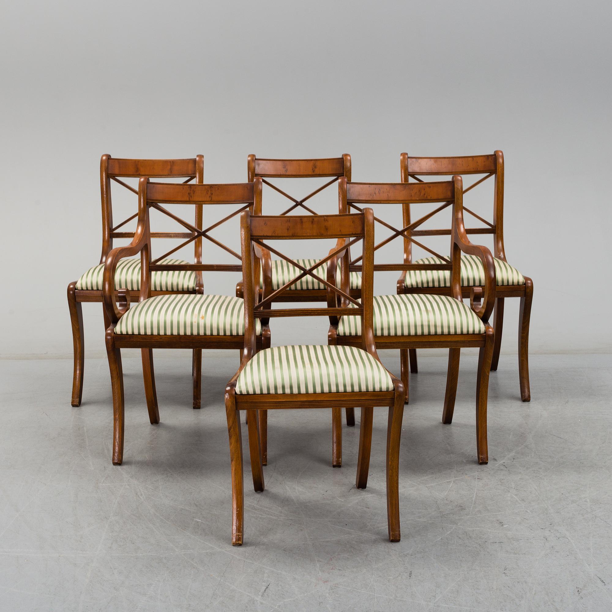 A late 20th century English style dining table and six chairs.