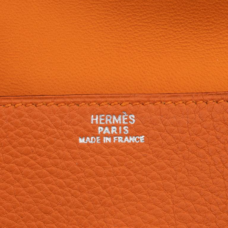 Hermès, a orange leather 'Dogon' wallet, 1998.