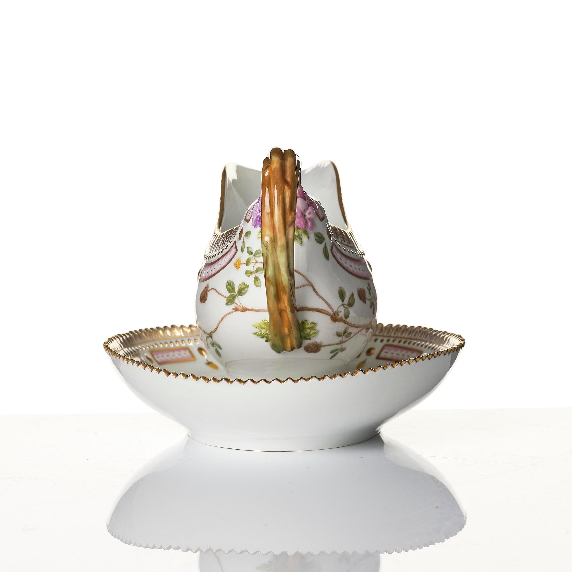A Royal Copenhagen 'Flora Danica' sauce boat and a pillow shaped bowl, Denmark, 20th century.