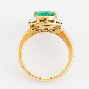 Pear shaped emerald and brilliant cut diamond ring.