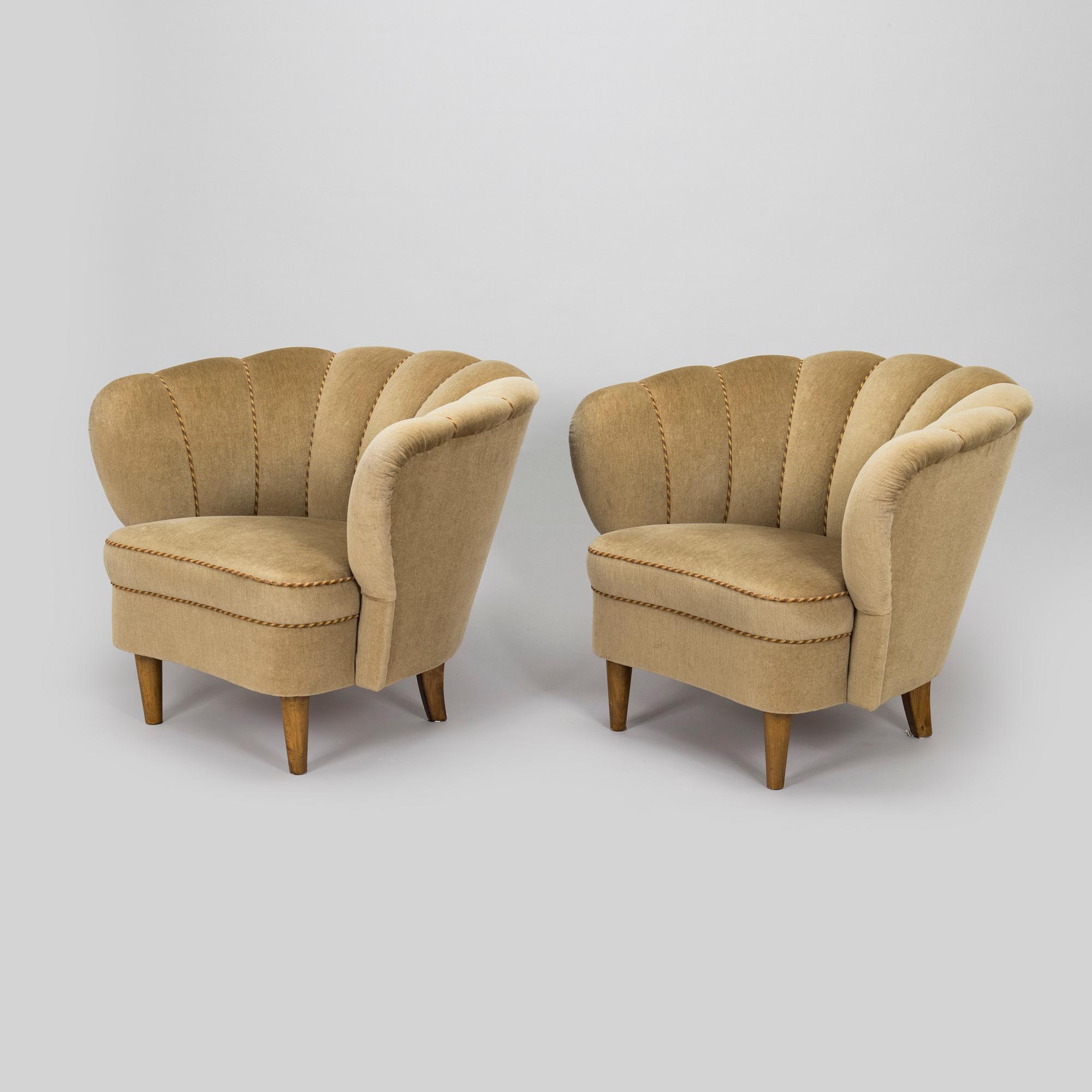 A pair of mid-20th century armchairs.