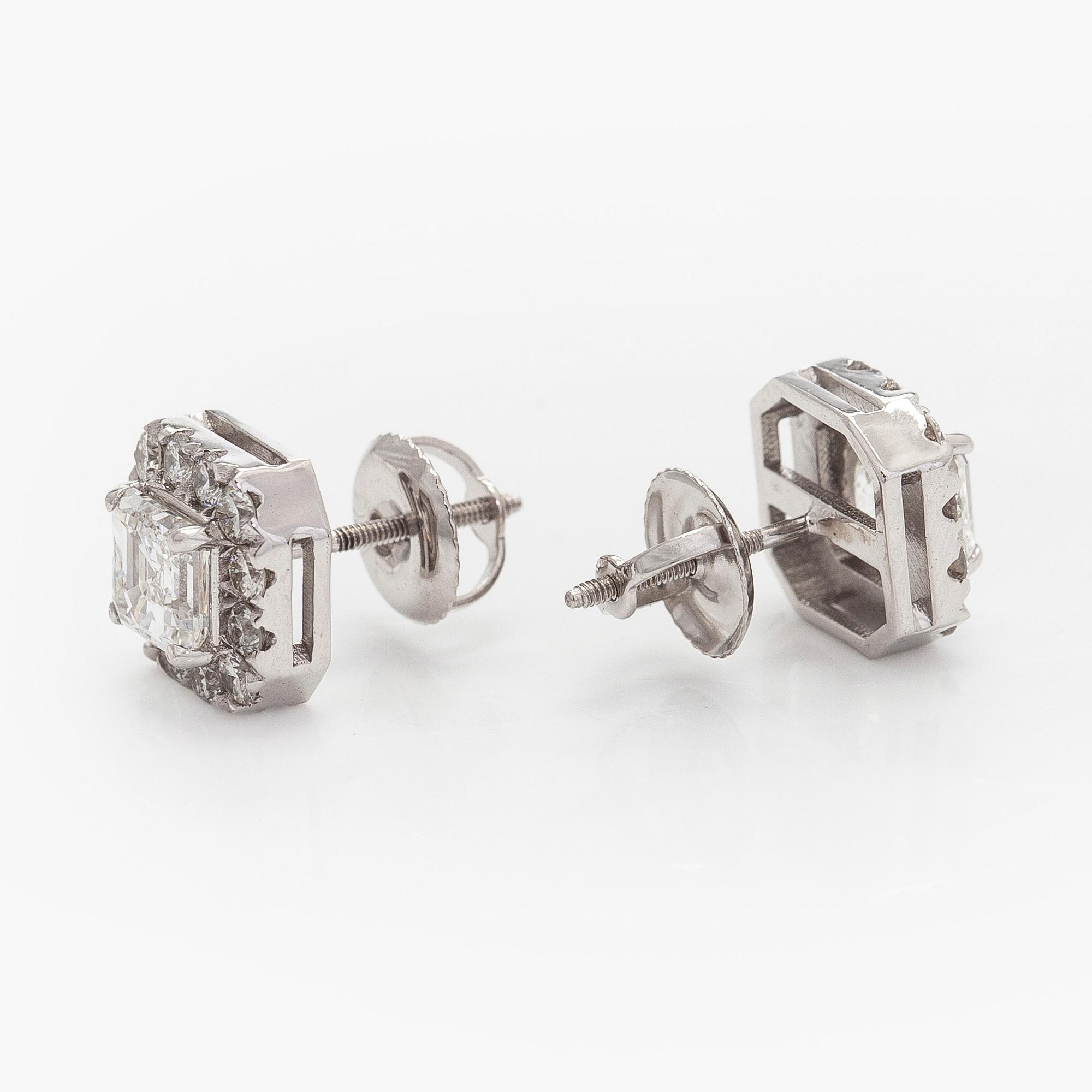 Earrings, emerald cut diamonds 0.70 ct / each and brilliant cut diamonds, 18K white gold.