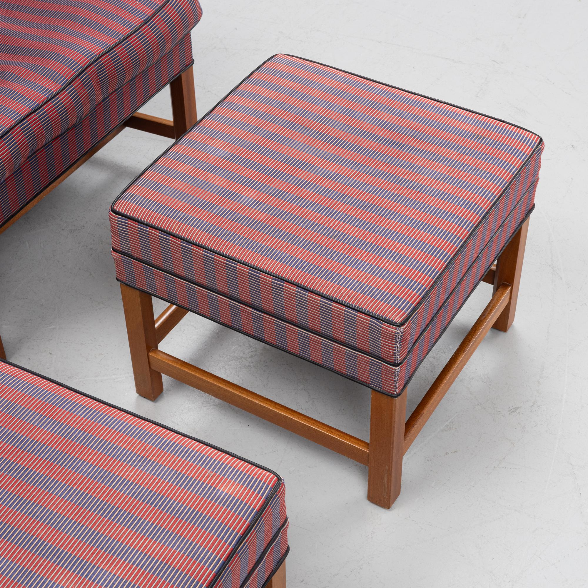 Kaare Klint, a pair of model 6212 armchairs with ottomans, Rud Rasmussen, Denmark.