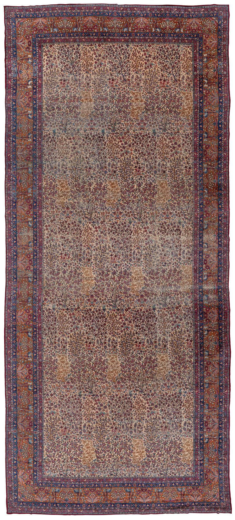 An antique 'Millefleur' Kerman Laver carpet, c. 964 x 426 cm.