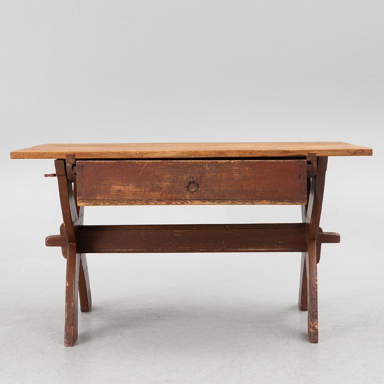 A Swedish folk-art trestle table from Dalarna, dated 1854.